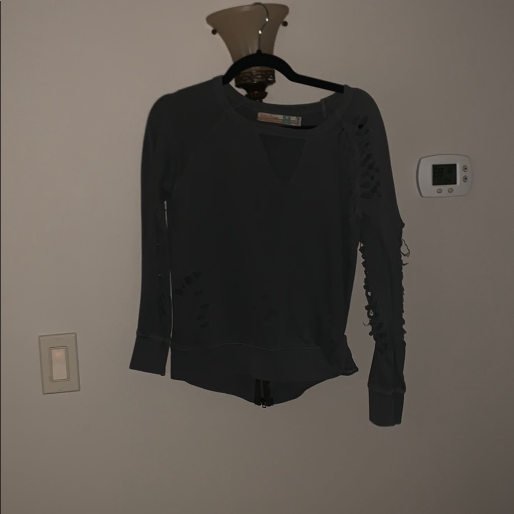 gray long sleeve with open neck and rips